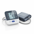 Digital blood pressure monitor with cuff on white background